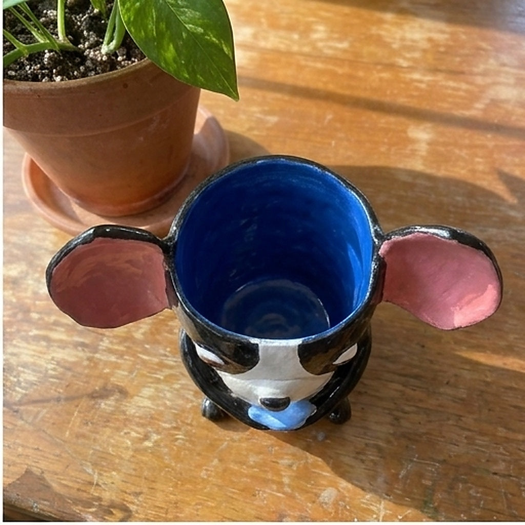 Joy the Boston Terrier ceramic vase, top-down view showing the blue glazed interior