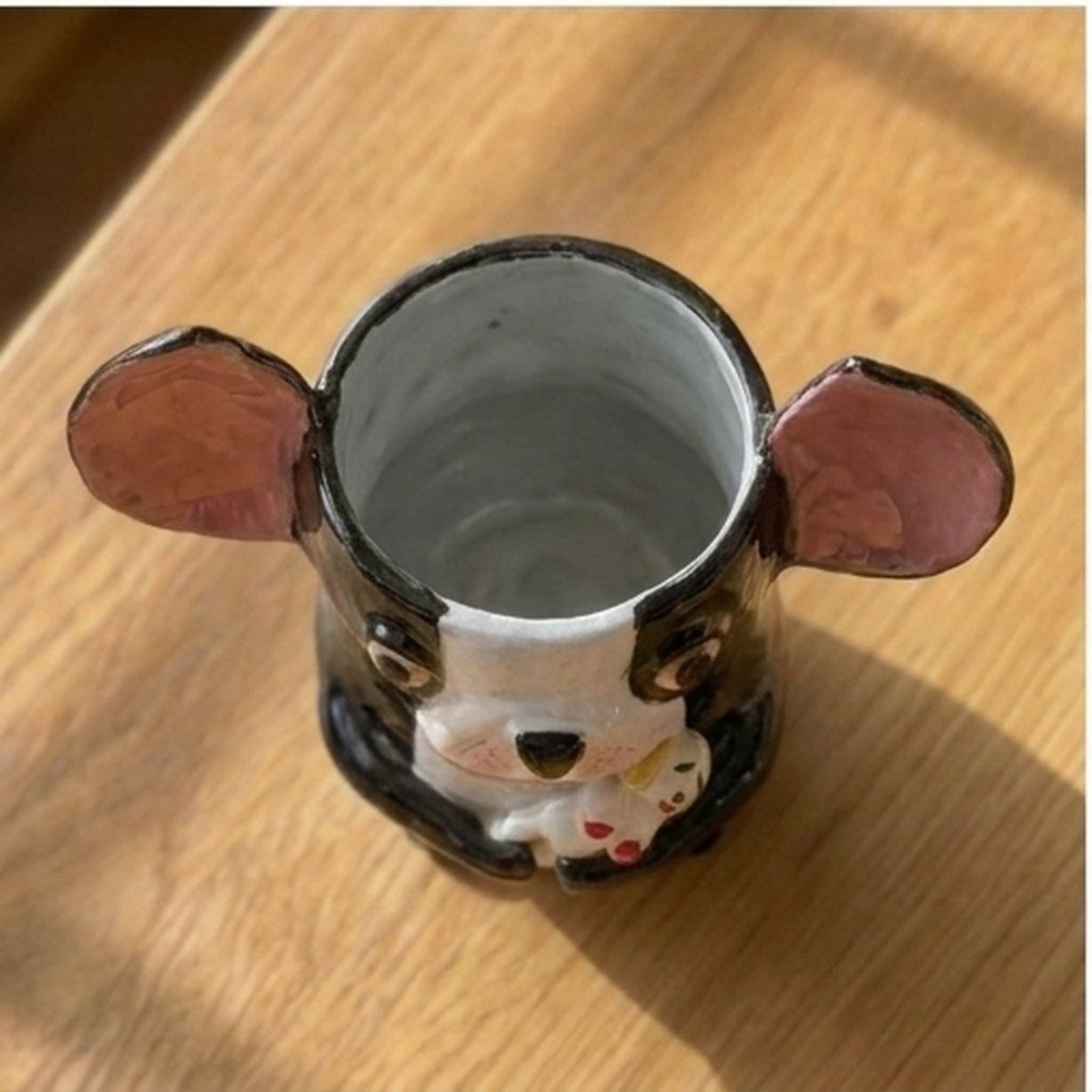 Theo the Boston Terrier ceramic vase, top-down view showing the grey glazed interior