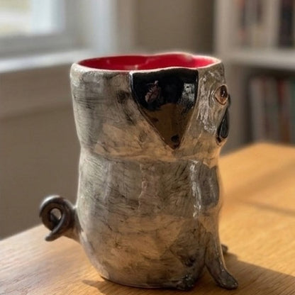 Archie the black pug ceramic vase, rear view showing the curly tail