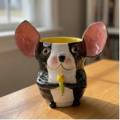 Clara the Boston Terrier ceramic vase, angled view showing the yellow glazed interior and tulip