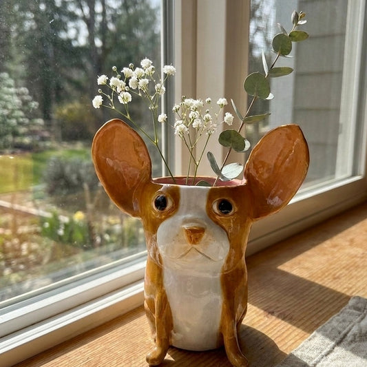 Hazel the tan and white Boston Terrier ceramic vase with baby's breath and eucalyptus