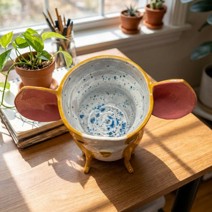 Mabel the Boston Terrier ceramic vase, top-down view showing the blue speckled glazed interior