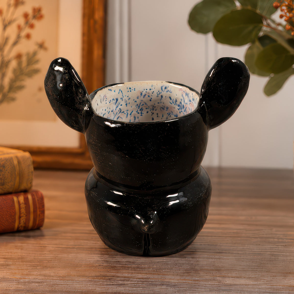 Norman, a handmade ceramic Boston Terrier vase, back view with upright ears and a little tail