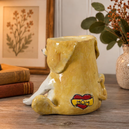 Vinnie, a handmade ceramic mixed breed dog vase, angled back view showing his floppy ears and MOM heart tattoo