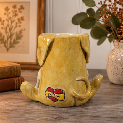 Vinnie, a handmade ceramic mixed breed dog vase, back view with a curled tail and a red MOM heart tattoo